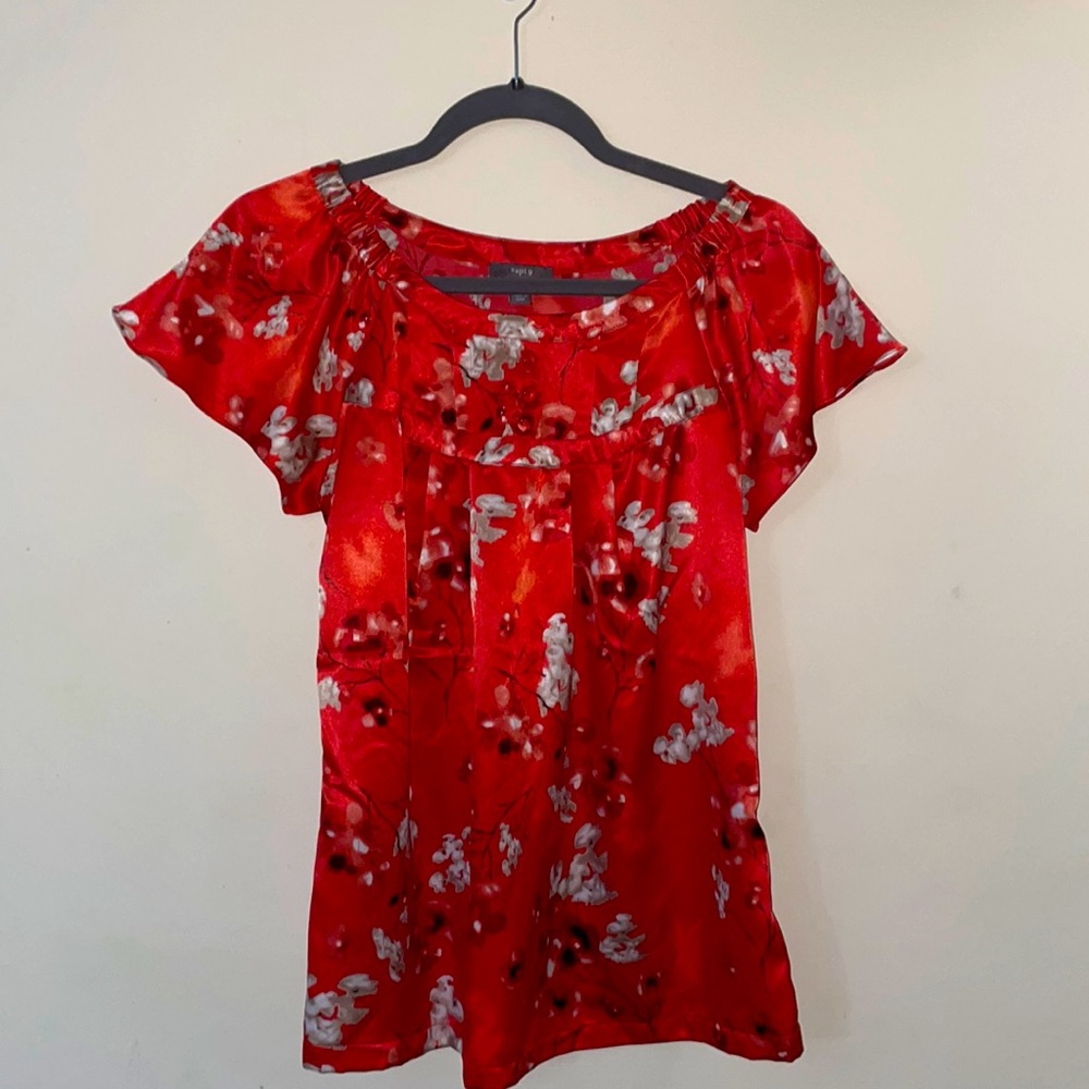 Beautiful red blouse with cream floral accent.
